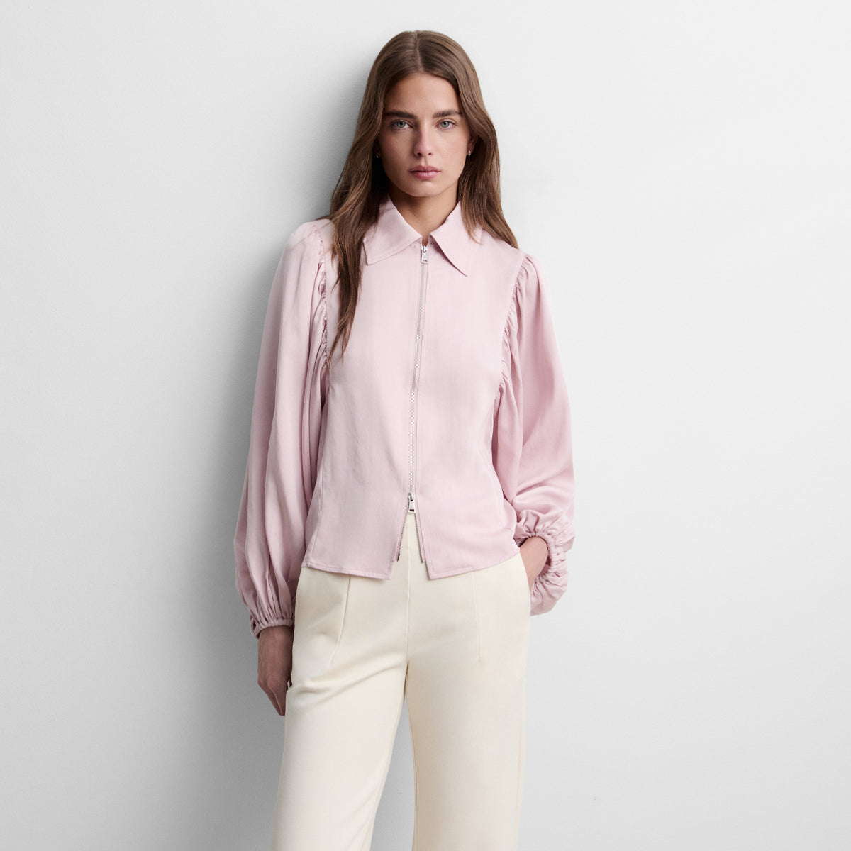 Blusa cremallera manga abullonada