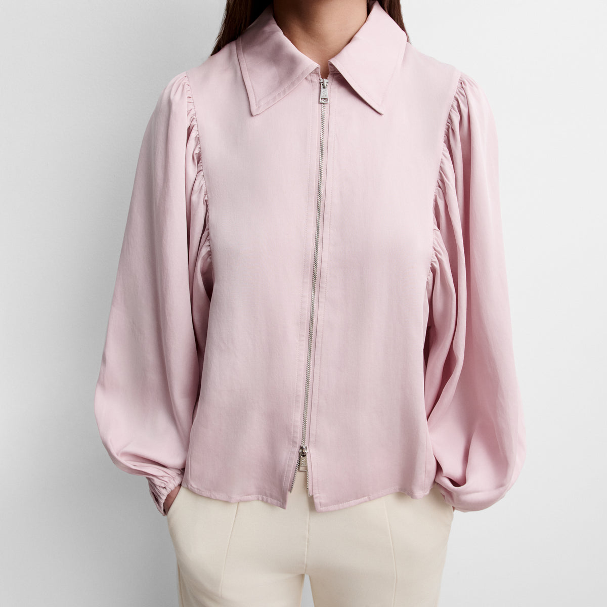 Blusa cremallera manga abullonada
