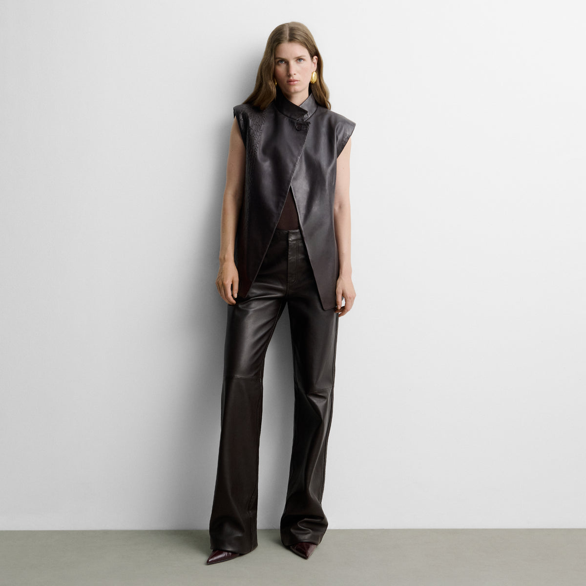 Faux leather gilet with woven straps
