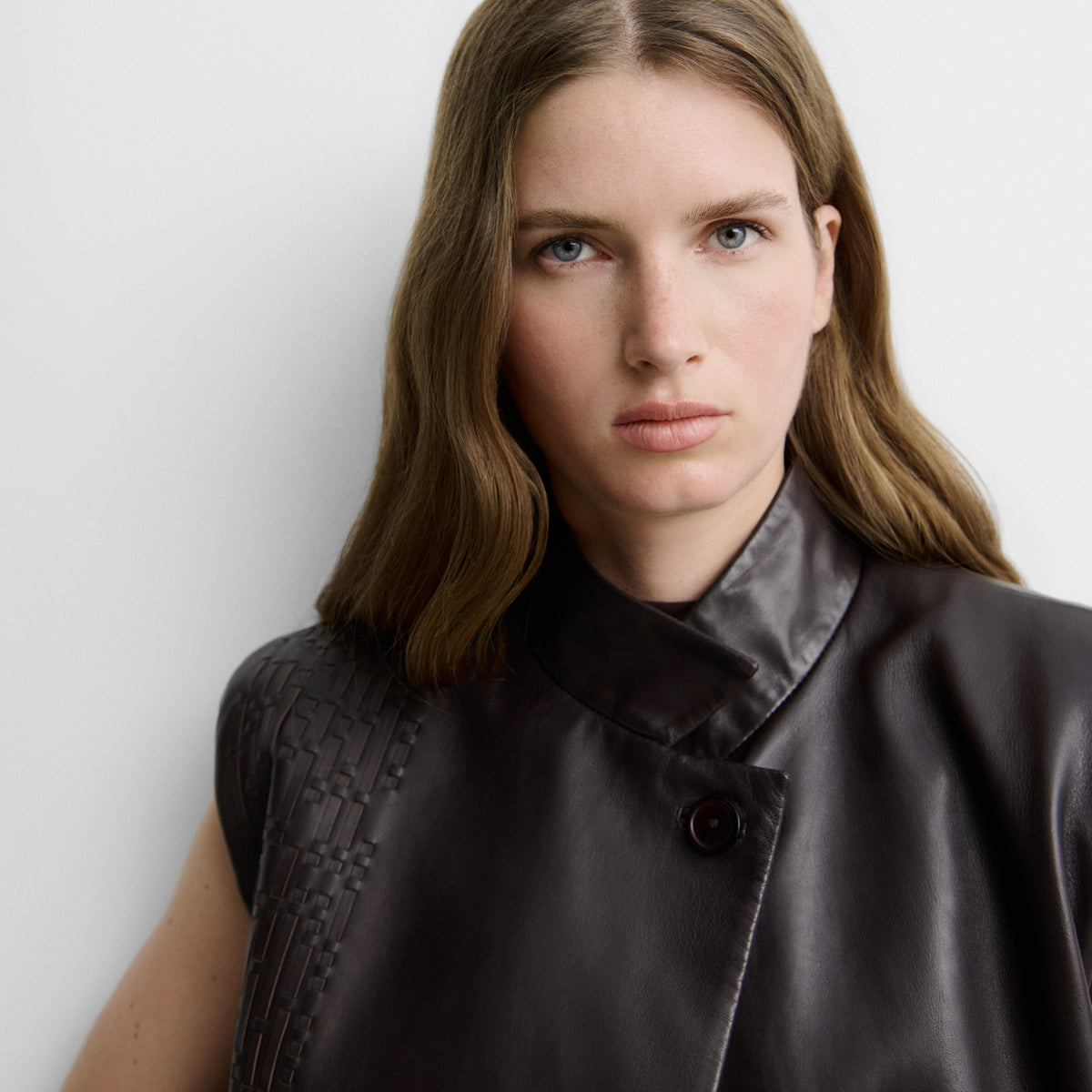 Faux leather gilet with woven straps