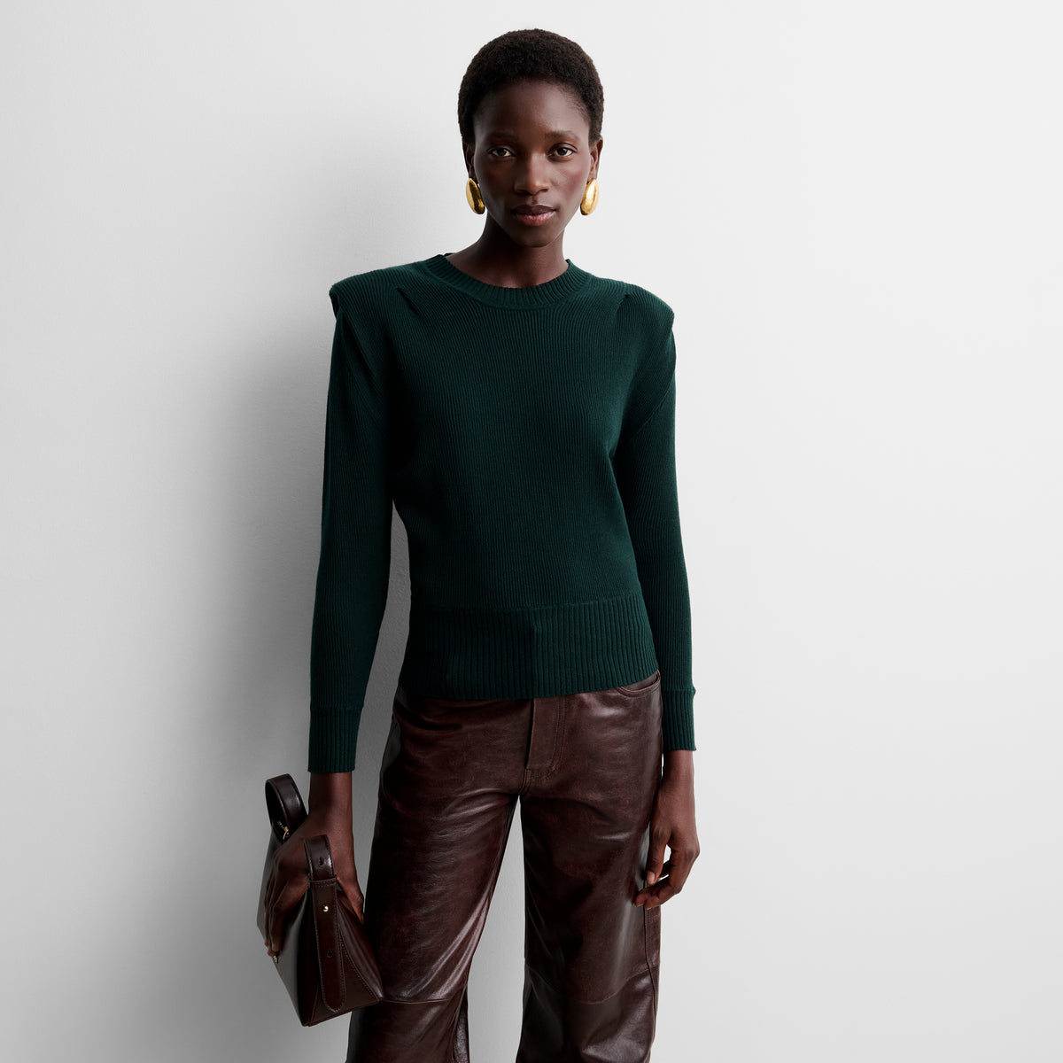Knit sweater with shoulder pads