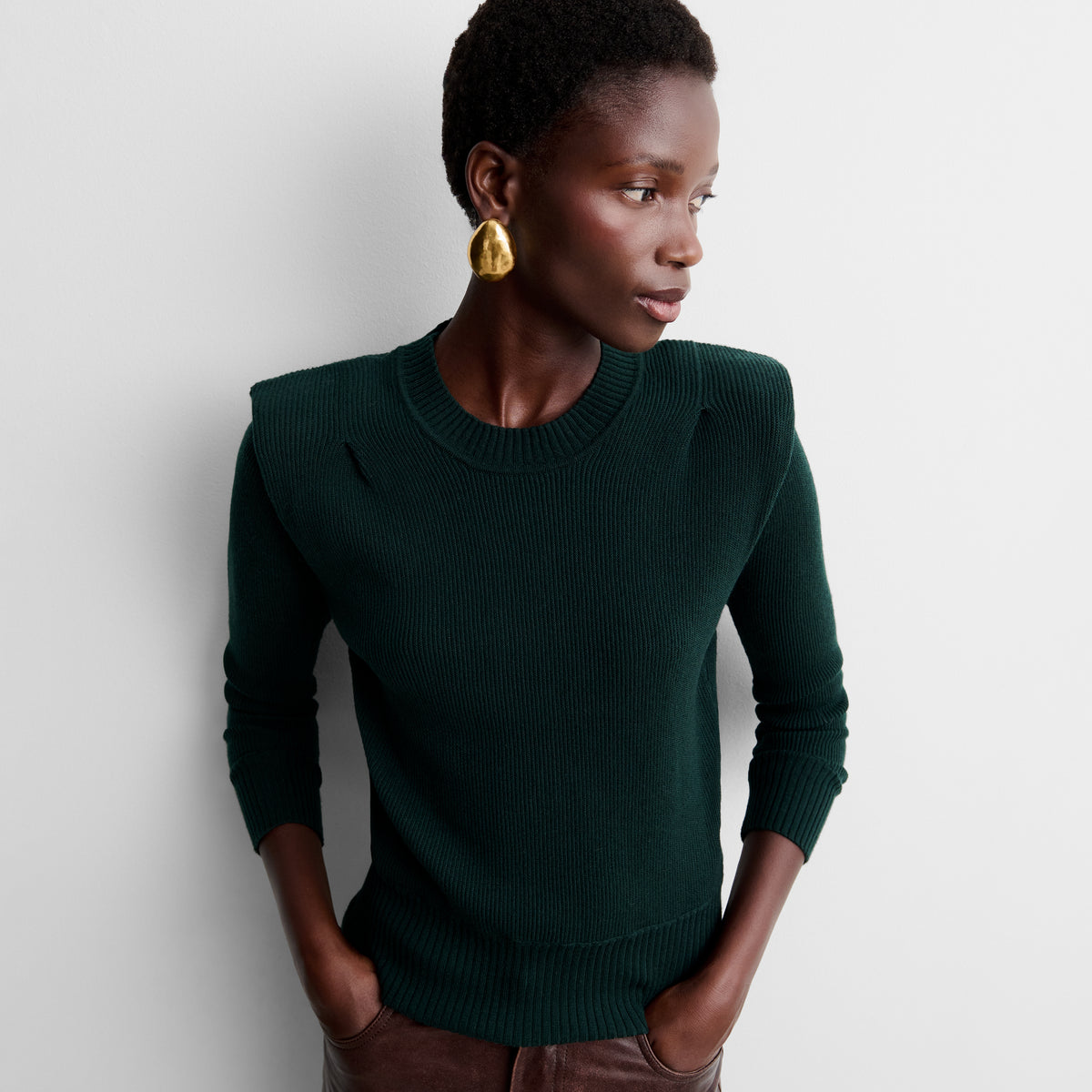 Knit sweater with shoulder pads